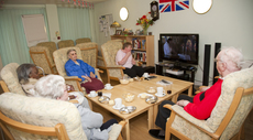 Residents at Miranda House attending their regular film club in the communal lounge at Miranda House  21 Penzance Place London W11 4PD