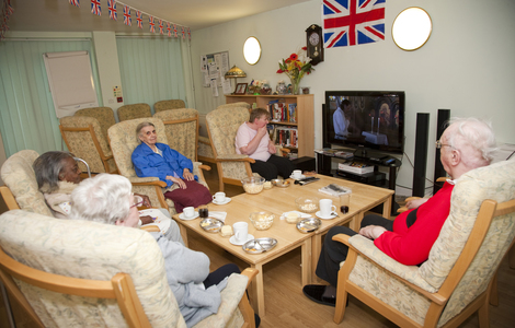 Residents at Miranda House attending their regular film club in the communal lounge at Miranda House  21 Penzance Place London W11 4PD